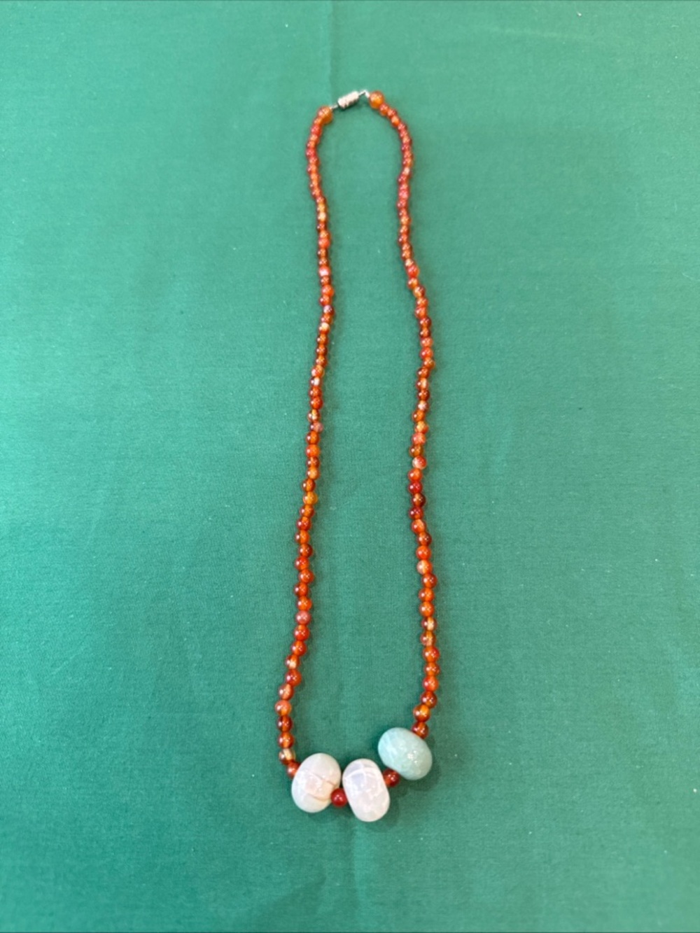 Orange Beaded Necklace with Pale Green and White Stone Accents